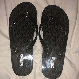 Two brand new Michael Kors flip flops